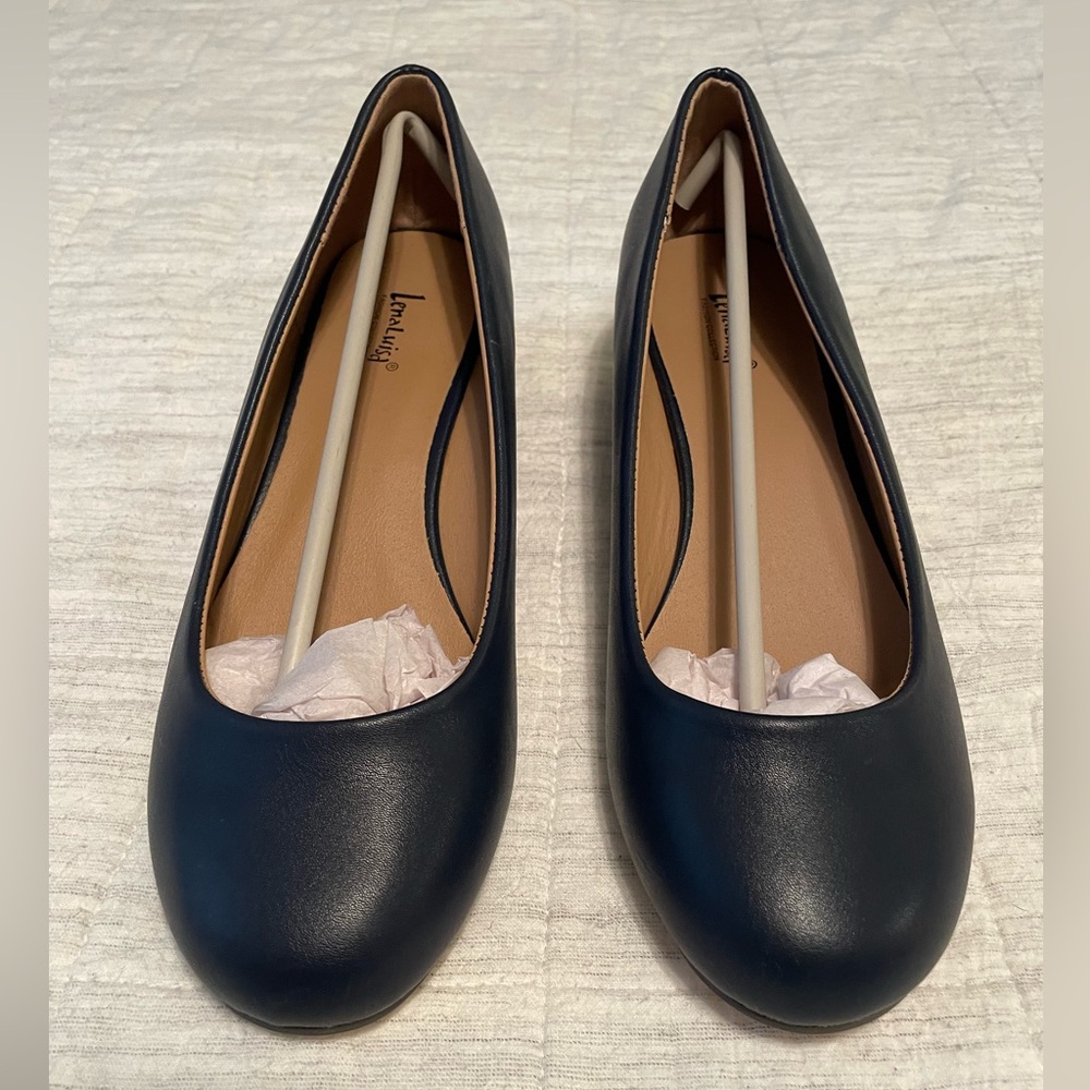 Navy blue closed low wedge shoe, size8, never worn.